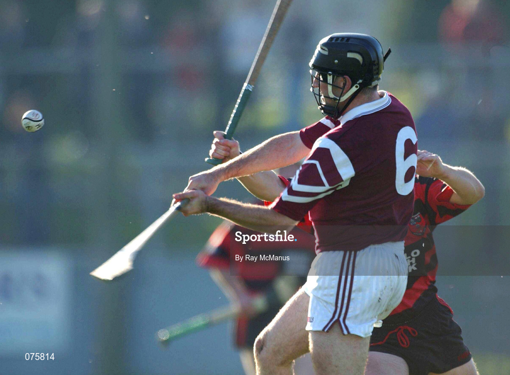 28 October 2001; Sean McMahon of St Josephs Doora Barefield clears under pressure from Mick Mahony of Ballygunner during the AIB Munster Senior Club Hurling Championship Quarter-Final match between Ballygunner and St Joseph's Doora Barefield at Walsh Park in Waterford. Photo by Ray McManus/Sportsfile