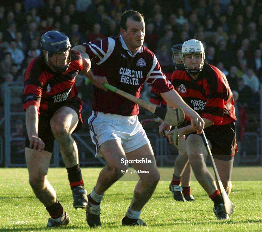 28 October 2001; Ollie Baker of St Joseph's Doora Barefield, under pressure from Andy Moloney, left, and Alan Kinwan, both of Ballygunner, during the AIB Munster Senior Club Hurling Championship Quarter-Final match between Ballygunner and St Joseph's Doora Barefield at Walsh Park in Waterford. Photo by Ray McManus/Sportsfile