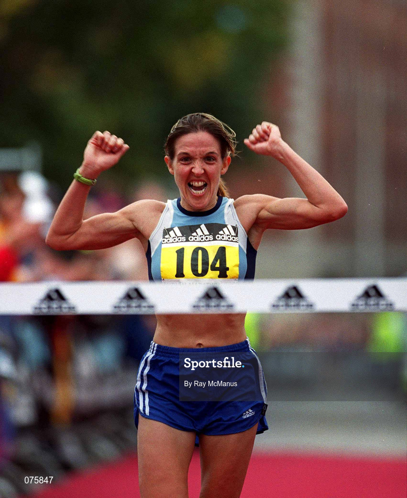 29 October 2001; Debbie Robinson celebrates as she crosses the finish line to be first woman home in the adidas Dublin Marathon 2001 in Dublin. Photo by Ray McManus/Sportsfile