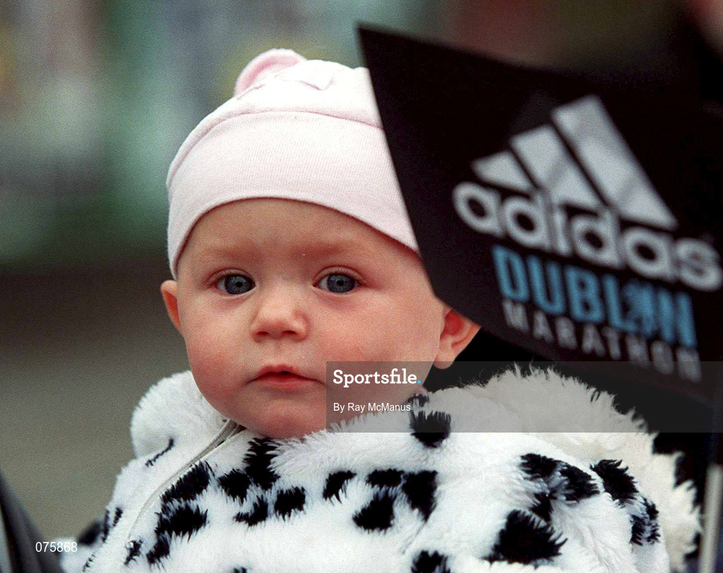 29 October 2001; 11 month year old Alaoisa O'Keeffe from Smithfield watches the finish of the adidas Dublin Marathon in Dublin. Photo by Ray McManus/Sportsfile