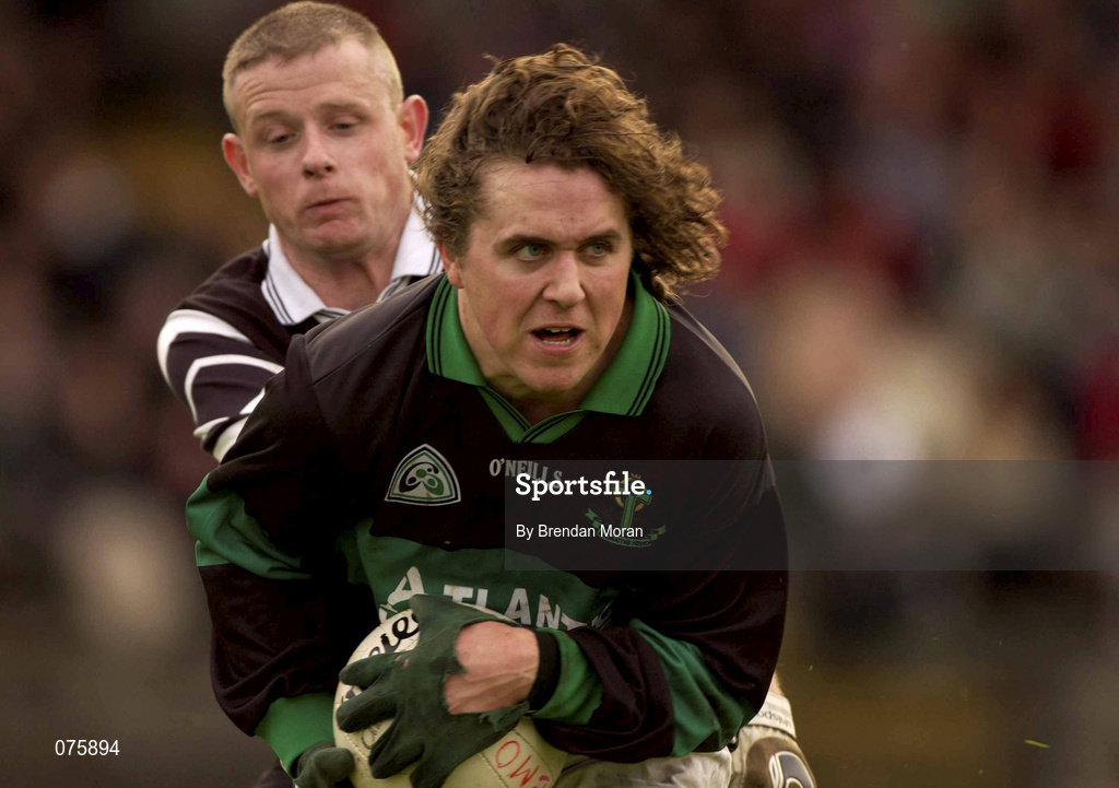 27 October 2001; Alan Cronin of Nemo Rangers is tackled by Declan Griffin of Doonbeg during the AIB Munster Senior Club Football Championship Quarter-Final match between Nemo Rangers and Doonbeg at Páirc Uí Rinn in Cork. Photo by Brendan Moran/Sportsfile