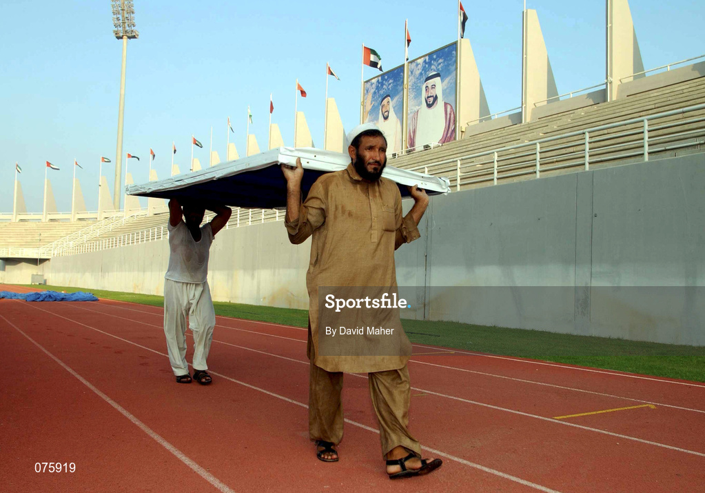 30 October 2001; Local Groundsmen ready the advertising boards along the side of the pitch at the Al-Nahyan Stadium ahead of the the 2002 FIFA World Cup AFC Qualification Play-Off 2nd Leg match between United Arab Emirates and Iran the at Al-Nahyan Stadium in Abu Dhabi, United Arab Emirates. Photo by David Maher/Sportsfile