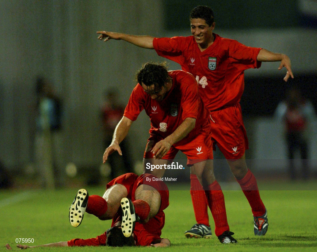 31 October 2001; Kharim Bagheri of Iran, left, celebrates with team-mates Ali Karimi, centre, and Mujahed Khaziravi,right, after scoring his side's second goal during the 2002 FIFA World Cup AFC Qualification Play-Off 2nd Leg match between United Arab Emirates and Iran the at Al-Nahyan Stadium in Abu Dhabi, United Arab Emirates. Photo by David Maher/Sportsfile
