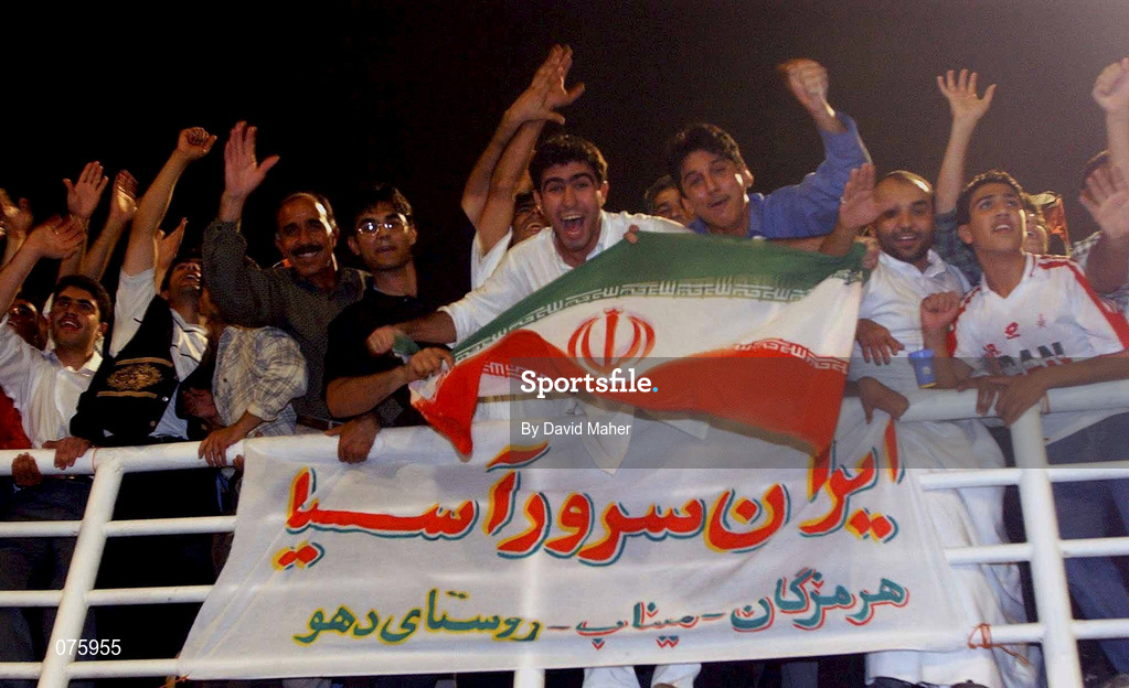 31 October 2001; Iranian supporterscelebrate at the end of the game after victory over the United Arab Emirates in the 2002 FIFA World Cup AFC Qualification Play-Off 2nd Leg match between United Arab Emirates and Iran the at Al-Nahyan Stadium in Abu Dhabi, United Arab Emirates. Photo by David Maher/Sportsfile