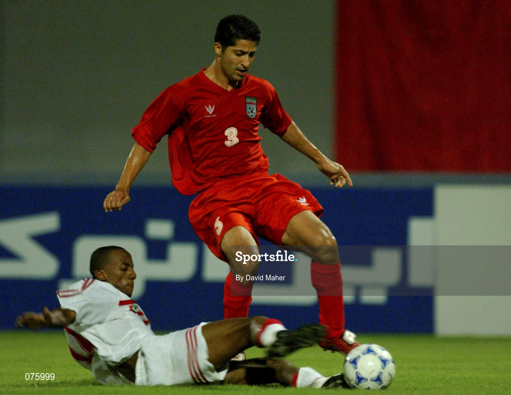 31 October 2001; Mehrdad Minavand of Iran in action againast Faisal Khalil Sebait Mubarak of United Arab Emirates  during the 2002 FIFA World Cup AFC Qualification Play-Off 2nd Leg match between United Arab Emirates and Iran the at Al-Nahyan Stadium in Abu Dhabi, United Arab Emirates. Photo by David Maher/Sportsfile