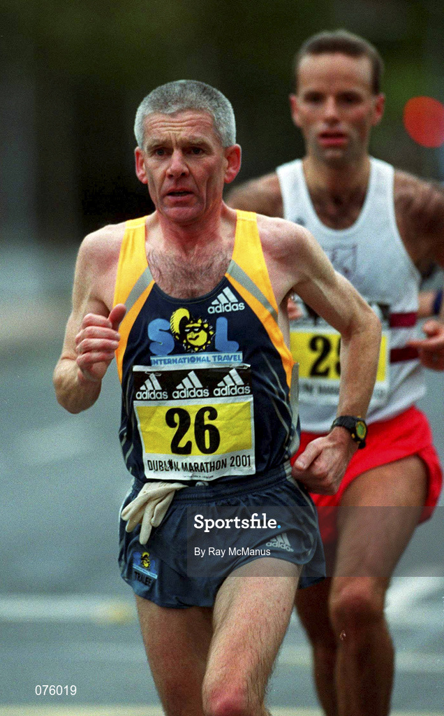 29 October 2001; John Griffin, 26, Ireland, closely followed by Ireland's Pauric McKinney during the adidas Dublin Marathon in Dublin. Photo by Ray McManus/Sportsfile