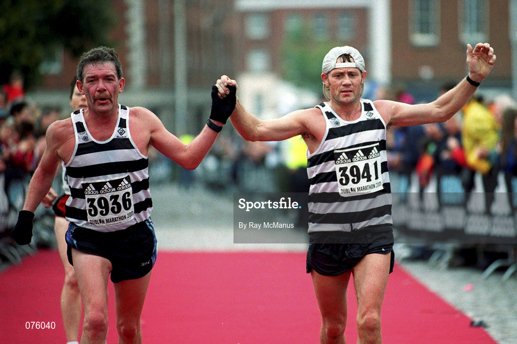 29 October 2001; Ireland's Robert Pollock, left, and Michael McNicholl approach the finishing line at the adidas Dublin Marathon in Dublin. Photo by Ray McManus/Sportsfile