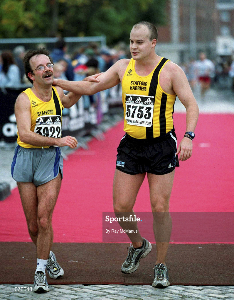 29 October 2001; Mark Bentley, England, left, is congratulated by South Africa's Deon Vlok, right, at the end of the adidas Dublin Marathon in Dublin. Photo by Ray McManus/Sportsfile