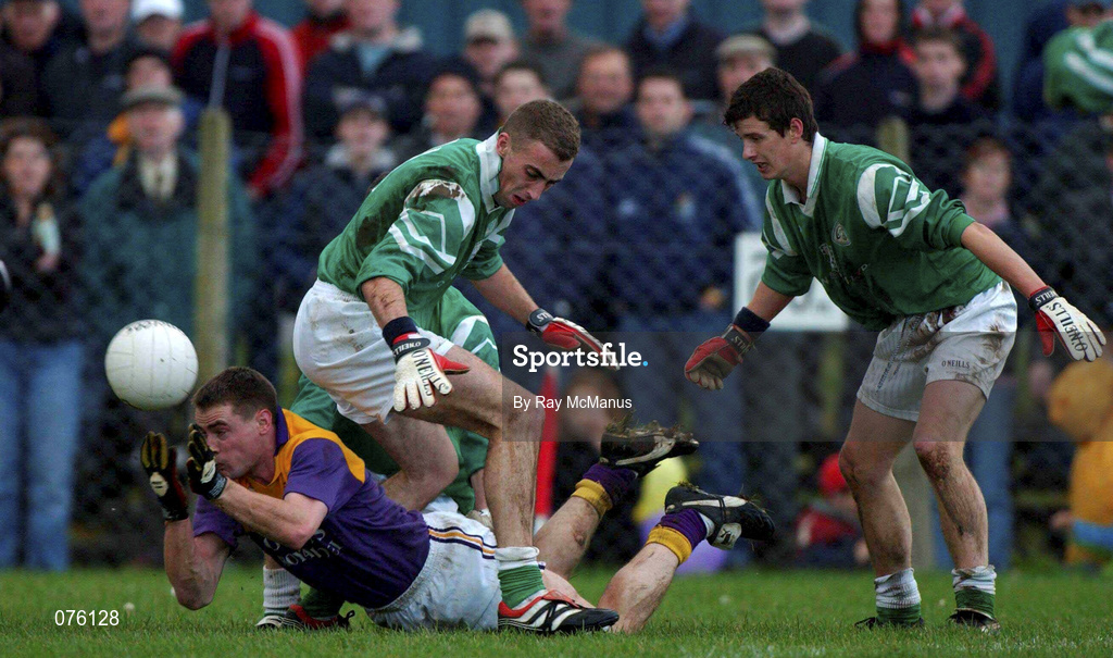 4 November 2001; Paul Noone of Roscommon Gaels clears under pressure from Mark Caffrey, left, and Aidan Higgins, both of Charlestown Sarsfields during the AIB Connacht Club Senior Football Championship Semi-final match between Charlestown Sarsfields and Roscommon Gaels at Fr O'Hara Memorial Park in Charlestown, Mayo. Photo by Ray McManus/Sportsfile