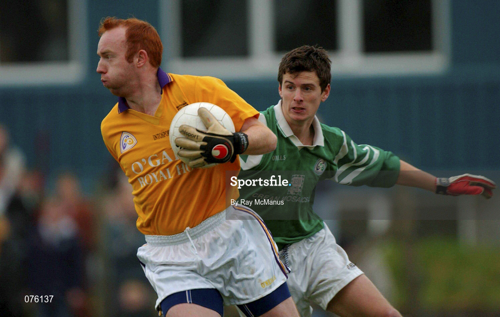 4 November 2001; Roscommon Gaels' goalkeeper Enda Daly clears under pressure from Aidan higgins of Charlestown Sarsfields during the AIB Connacht Club Senior Football Championship Semi-final match between Charlestown Sarsfields and Roscommon Gaels at Fr O'Hara Memorial Park in Charlestown, Mayo. Photo by Ray McManus/Sportsfile