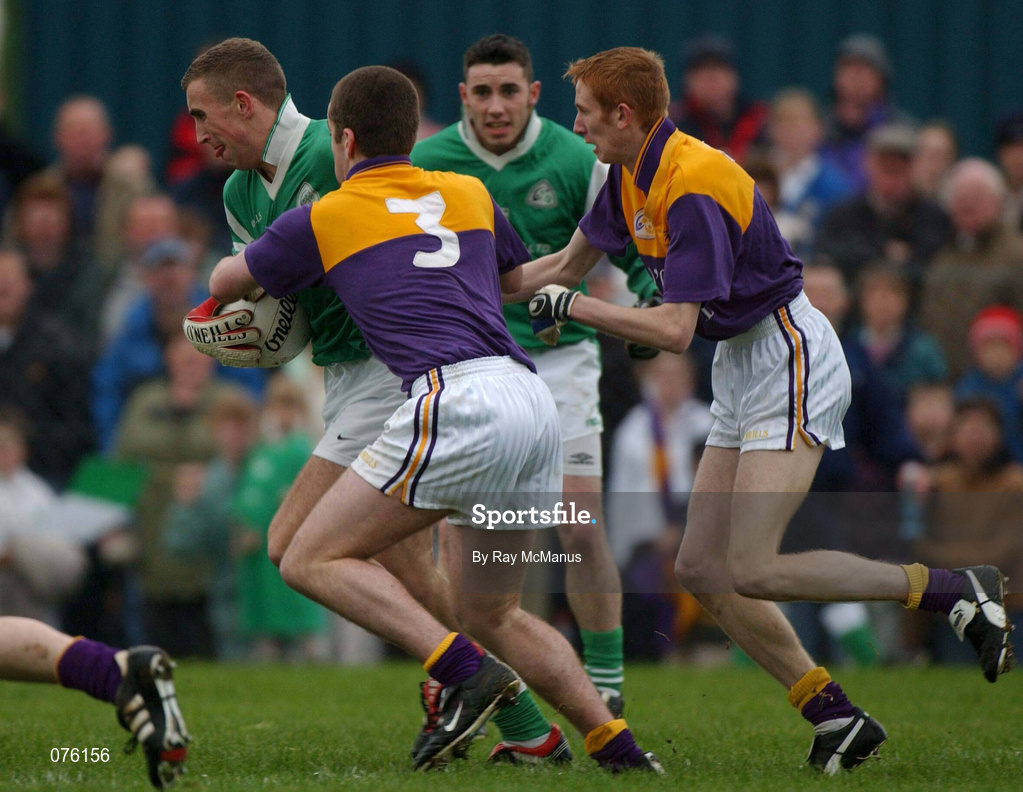 4 November 2001; Aidan Higgins of Charlestown Sarsfields in action against Brian McNella, 3, and Michael Costello, both of Roscommon Gaels, during the AIB Connacht Club Senior Football Championship Semi-final match between Charlestown Sarsfields and Roscommon Gaels at Fr O'Hara Memorial Park in Charlestown, Mayo. Photo by Ray McManus/Sportsfile