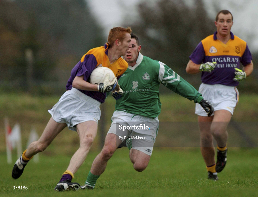 4 November 2001; Michael Costello of Roscommon Gaels n action against Sean Higgins of Charlestown Sarsfields during the AIB Connacht Club Senior Football Championship Semi-final match between Charlestown Sarsfields and Roscommon Gaels at Fr O'Hara Memorial Park in Charlestown, Mayo. Photo by Ray McManus/Sportsfile