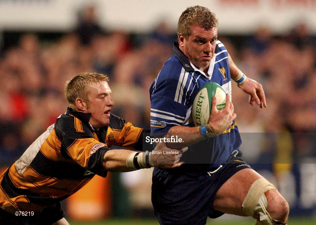 26 October 2001; Victor Costello of Leinster is tackled by Andrew Powell of Newport during the Heineken Cup Pool 6 Round 3 match between Leinster and Newport at Donnybrook Stadium in Dublin. Photo by Brian Lawless/Sportsfile