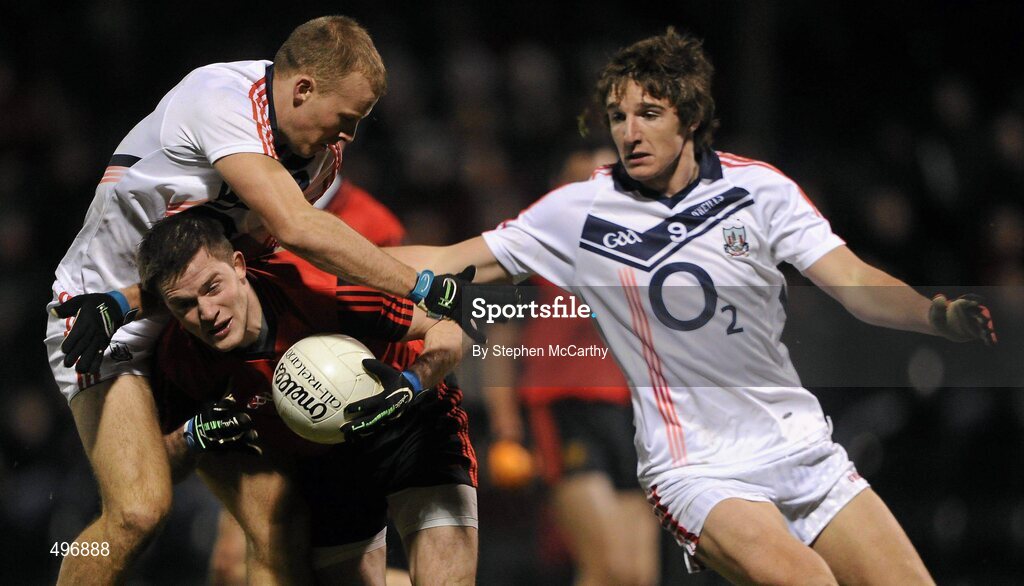 12 March 2011; Paul McComiskey, Down, in action against Michael Shields, left, and Aidan Walsh, Cork. Allianz Football League, Division 1, Round 4, Cork v Down, Pairc Ui Rinn, Cork. Picture credit: Stephen McCarthy / SPORTSFILE