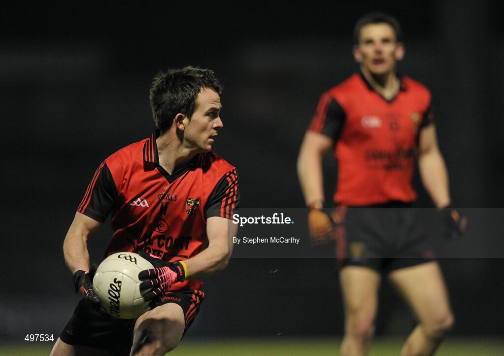 12 March 2011; Mark Poland, Down, supported by team-mate Daniel Hughes. Allianz Football League, Division 1, Round 4, Cork v Down, Pairc Ui Rinn, Cork. Picture credit: Stephen McCarthy / SPORTSFILE