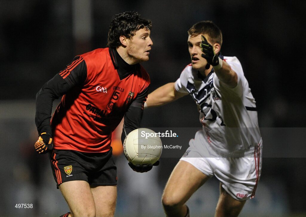 12 March 2011; Martin Clarke, Down, in action against Eoin Cadogan, Cork. Allianz Football League, Division 1, Round 4, Cork v Down, Pairc Ui Rinn, Cork. Picture credit: Stephen McCarthy / SPORTSFILE