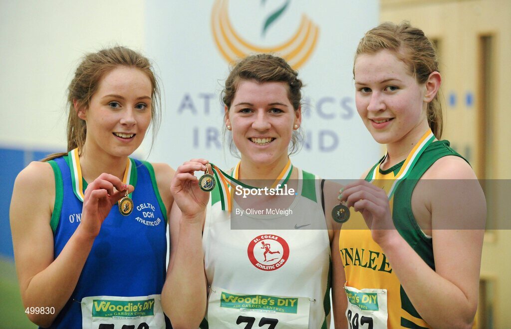 19 March 2011; U18 Girls 1500m winner Emily Miler, St Coca's, Co. Kildare, centre, with second place Siobhan McGinleym, Celtic DCH, Dublin, left, and third place Eadaoin O'Reilly, Annalee AC, Co.Cavan. Woodie’s DIY National Juvenile Indoor Championships, Meadowbank Indoor Arena, Magherafelt, Derry. Picture credit: Oliver McVeigh / SPORTSFILE