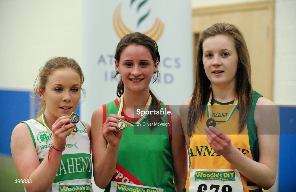 19 March 2011; U17 Girls 1500m winner Ellen Moran, Westport AC, Co. Mayo, centre, with second place Ellen O'Hanlon, Raheny Shamrocks AC, Dublin, left, and third place Laura Young, Annalee AC, Co. Cavan. Woodie’s DIY National Juvenile Indoor Championships, Meadowbank Indoor Arena, Magherafelt, Derry. Picture credit: Oliver McVeigh / SPORTSFILE