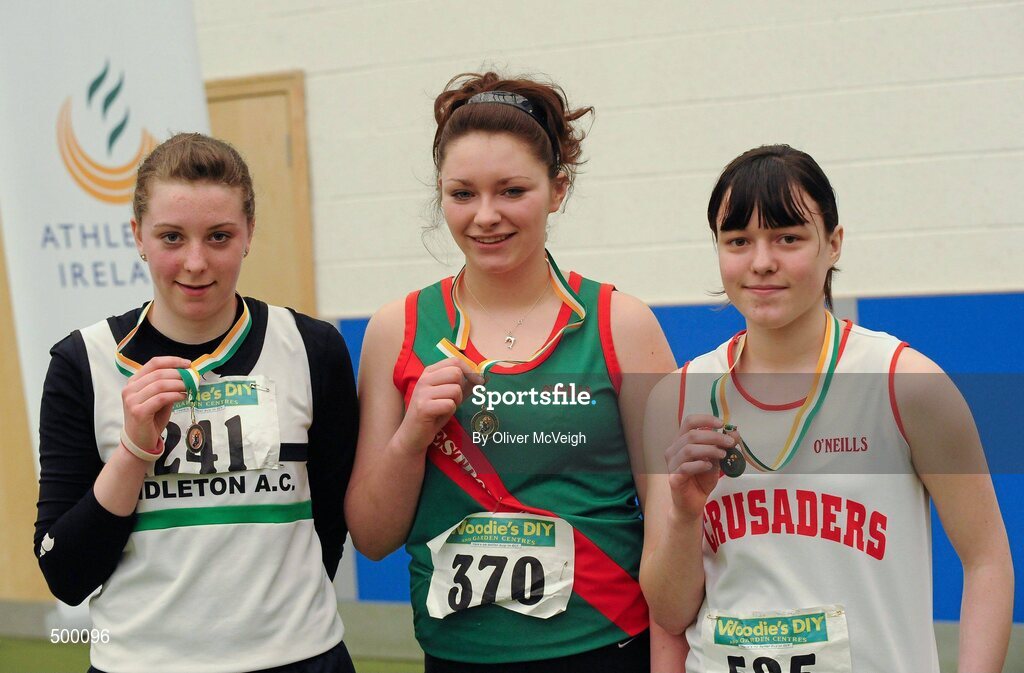 19 March 2011; U16 girls shot putt winner Niamh McLaughlin, Westport AC, Co. Mayo, centre, with second place Aideen Hallahan, Middleton AC, Co. Cork, left, and third place Alex Hughes, Crusaders, Dublin. Woodie’s DIY National Junior Indoor Championships, Meadowbank Indoor Arena, Magherafelt, Derry. Picture credit: Oliver McVeigh / SPORTSFILE