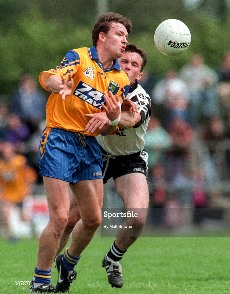 28 June 1998; Clifford McDonald of Roscommon is tackled by Dessie Sloyne of Sligo during the Bank of Ireland Connacht Senior Football Championship Semi-Final match between Roscommon and Sligo at Dr Hyde Park in Roscommon. Photo by Matt Browne/Sportsfile