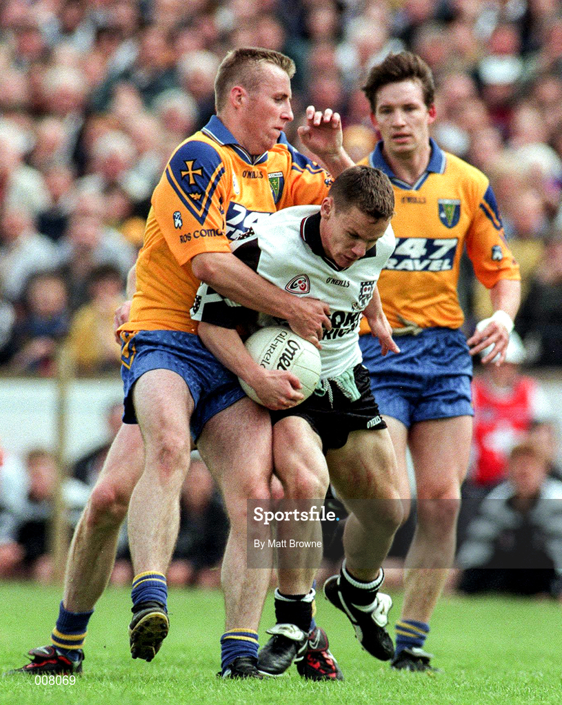 28 June 1998; Gerry McGowan of Sligo is tackled by Michael Ryan and Clifford McDonald of Roscommon during the Bank of Ireland Connacht Senior Football Championship Semi-Final match between Roscommon and Sligo at Dr Hyde Park in Roscommon. Photo by Matt Browne/Sportsfile
