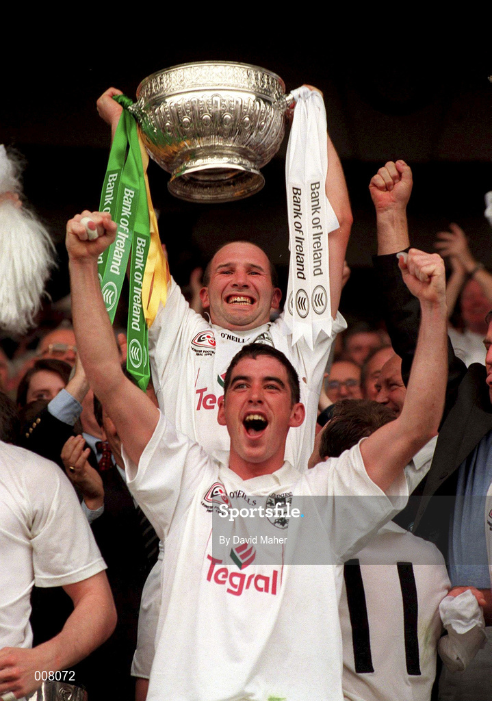 2 August 1998; Kildare captain Glenn Ryan lifts the Delaney Cup behind his team-mate Anthony Rainbow following the Bank of Ireland Leinster Senior Football Championship Final match between Kildare and Meath at Croke Park in Dublin. Photo by David Maher/Sportsfile