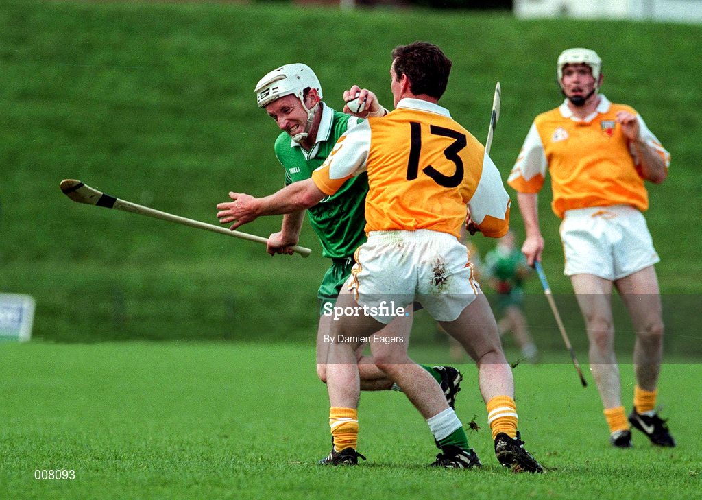 21 June 1998; JJ Shiels of London in action against Alistair Elliott of Antrim during the Guinness Ulster Senior Hurling Championship Semi-Final Replay match between Antrim and London at Casement Park in Belfast, Antrim. Photo by Damien Eagers/Sportsfile