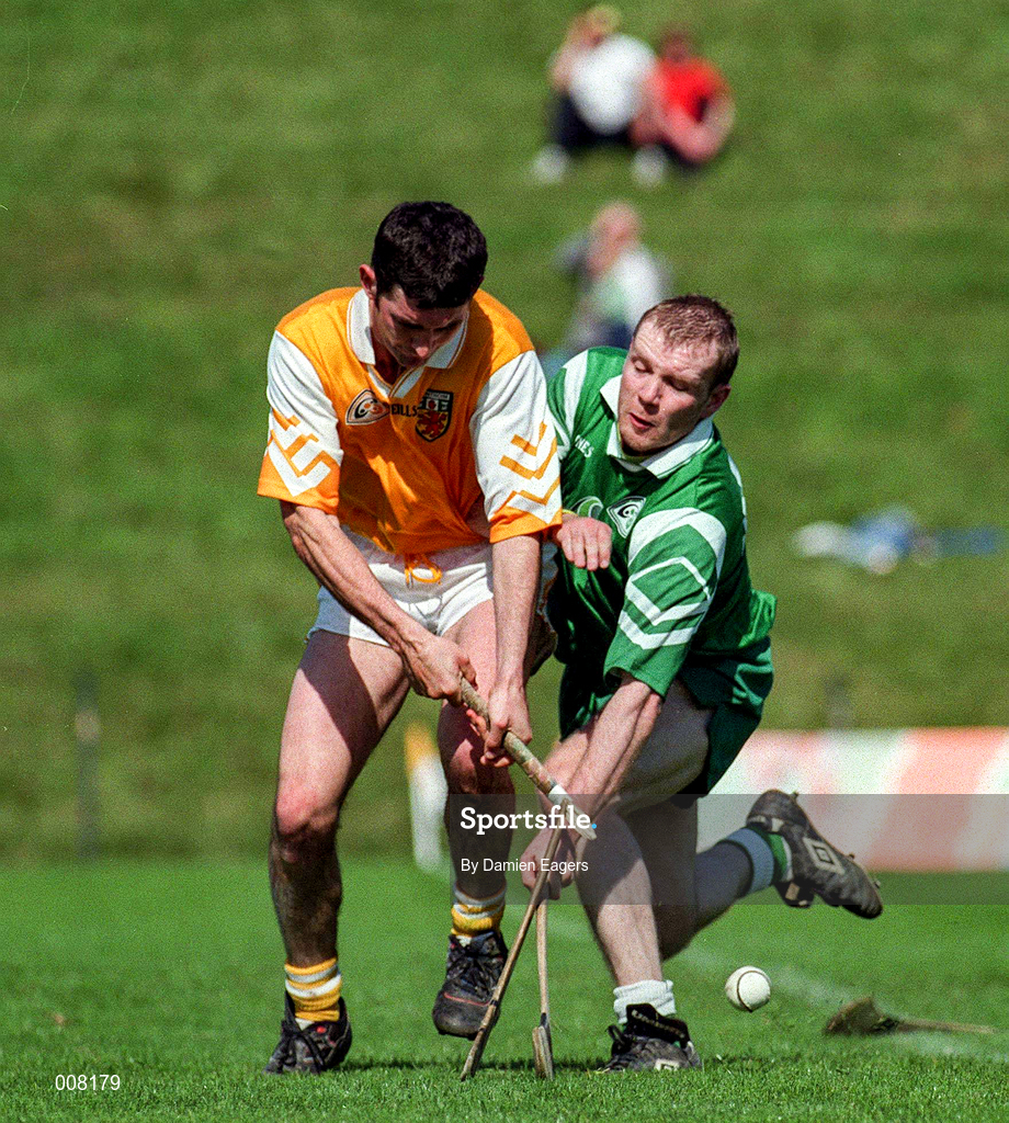 14 June 1998; Frank McMullan of Antrim in action against Eoin Quaine of London during the Guinness Ulster Senior Hurling Championship Semi-Final match between Antrim and London at Casement Park in Belfast, Antrim, Antrim. Photo by Damien Eagers/Sportsfile