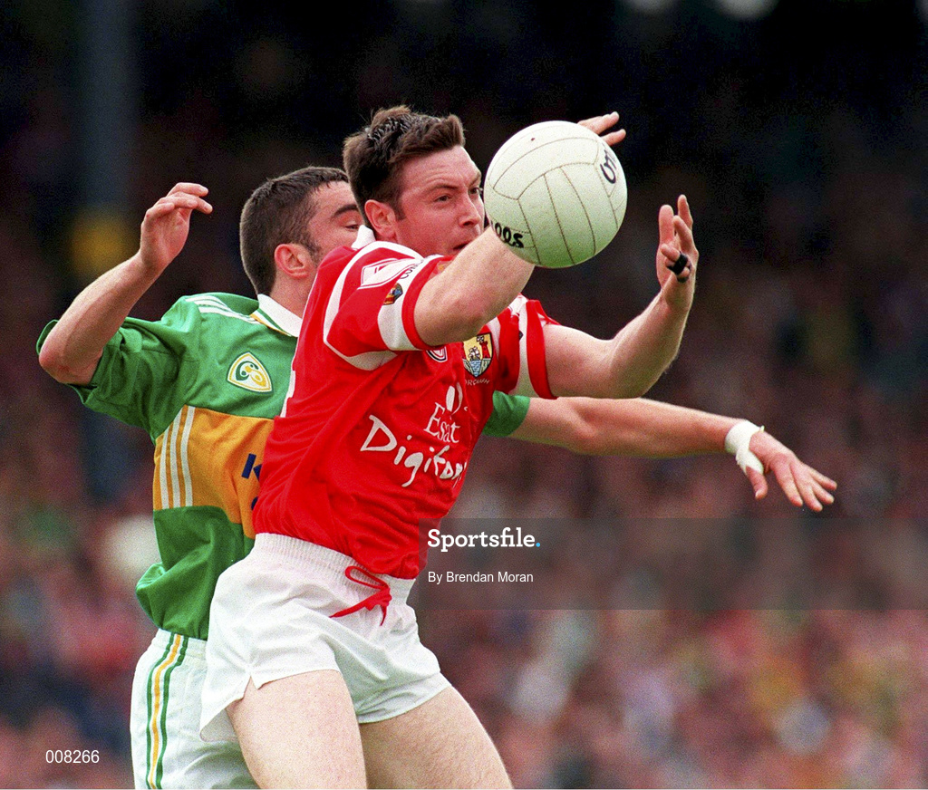 5 July 1998; Joe Kavanagh of Cork in action against Barry O'Shea of Kerry during the Bank of Ireland Munster Senior Football Championship Semi-Final match between Kerry and Cork at Fitzgerald Stadium in Killarney, Kerry. Photo by Brendan Moran/Sportsfile