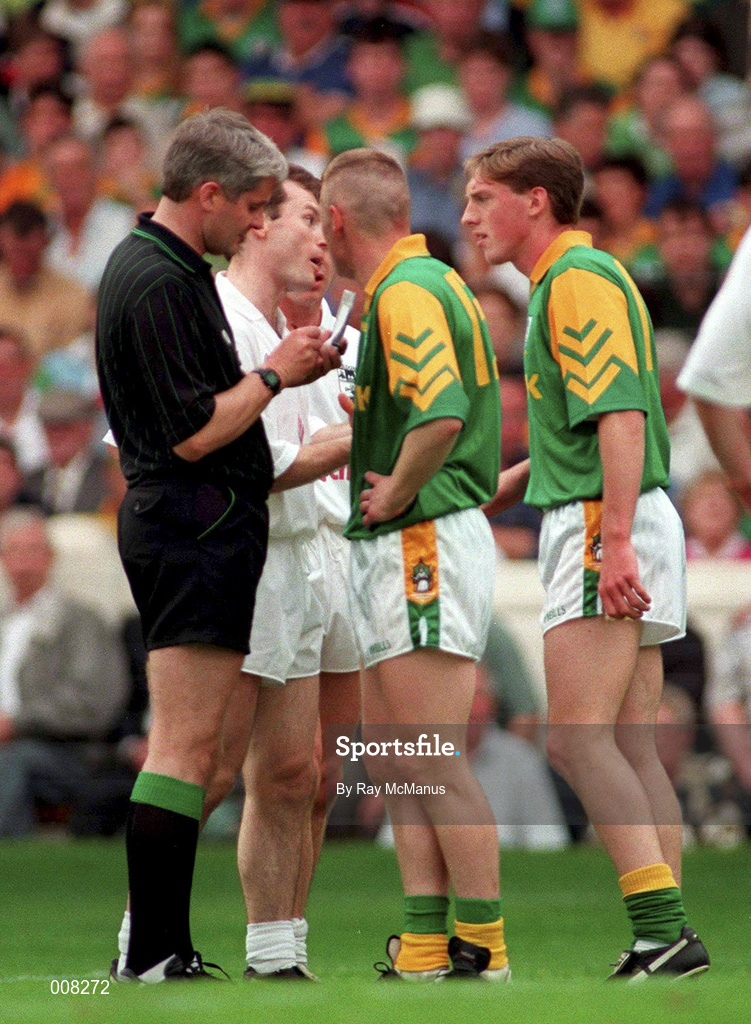 2 August 1998; Trevor Giles of Meath looks on as referee John Bannon books his team-mate Tommy Dowd during the Bank of Ireland Leinster Senior Football Championship Final match between Kildare and Meath at Croke Park in Dublin. Photo by Ray McManus/Sportsfile