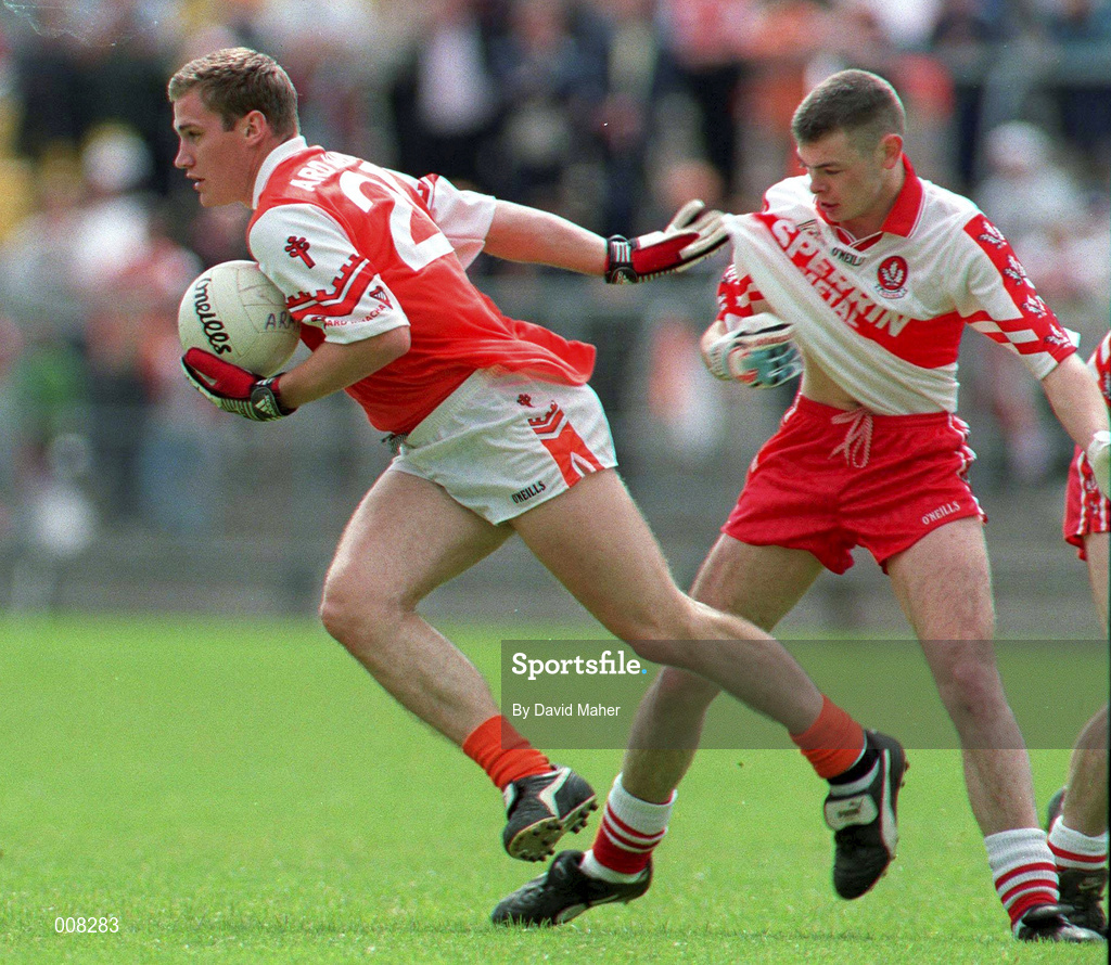28 June 1998; John McEnteey of Armagh is tackled by Dermot Dougan of Derry during the Bank of Ireland Ulster Senior Football Championship Semi-Final match between Armagh and Derry at St Tiernach's Park in Clones, Monaghan. Photo by David Maher/Sportsfile