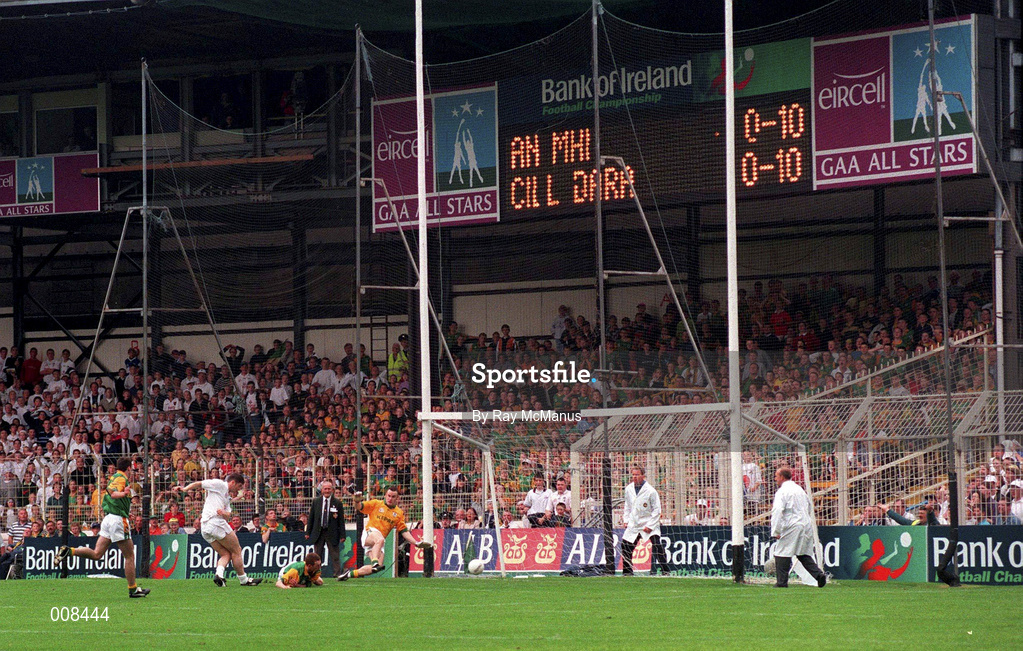 2 August 1998; Kildare substitute Bryan Murphy shoots past Meath goalkeeper Conor Martin and defender Donal Curtis to score his side's goal during the Bank of Ireland Leinster Senior Football Championship Final match between Kildare and Meath at Croke Park in Dublin. Photo by Ray McManus/Sportsfile