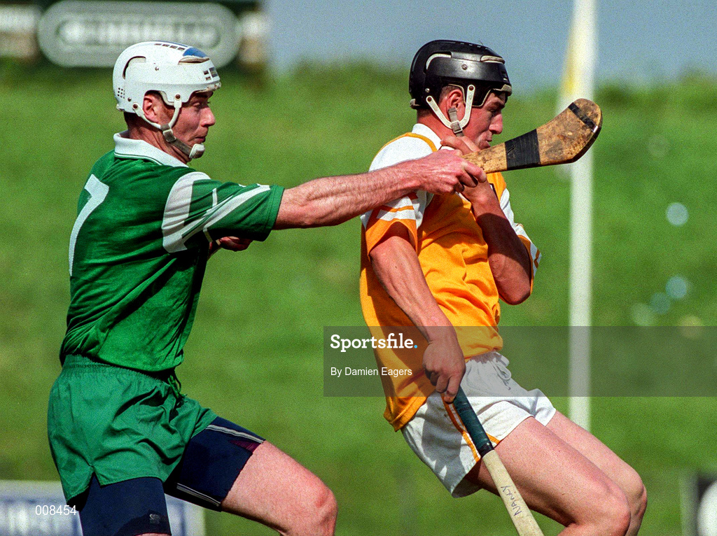 21 June 1998; Liam Richmond of Antrim in action against Billy Dolan of London during the Guinness Ulster Senior Hurling Championship Semi-Final Replay match between Antrim and London at Casement Park in Belfast, Antrim. Photo by Damien Eagers/Sportsfile