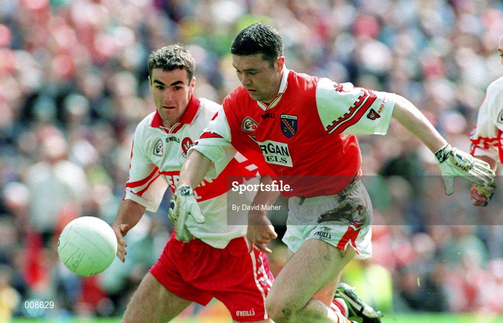 28 June 1998; Oisin McConville of Armagh in action against Sean Martin Lockhart of Derry during the Bank of Ireland Ulster Senior Football Championship Semi-Final match between Armagh and Derry at St Tiernach's Park in Clones, Monaghan. Photo by David Maher/Sportsfile