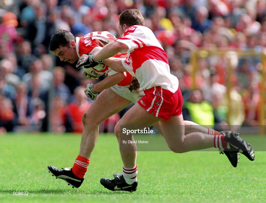 28 June 1998; Oisin McConville of Armagh in action against Kieran McKeever of Derry during the Bank of Ireland Ulster Senior Football Championship Semi-Final match between Armagh and Derry at St Tiernach's Park in Clones, Monaghan. Photo by David Maher/Sportsfile