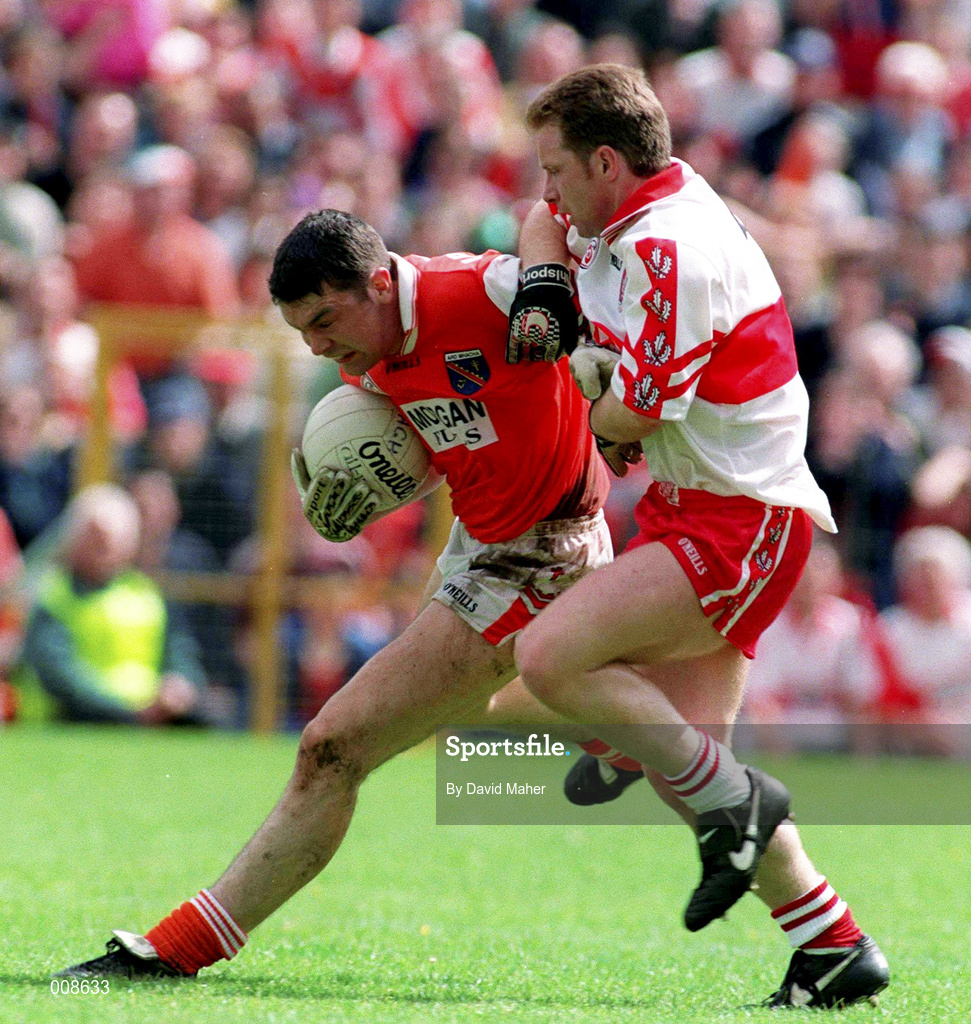 28 June 1998; Oisin McConville of Armagh in action against Kieran McKeever of Derry during the Bank of Ireland Ulster Senior Football Championship Semi-Final match between Armagh and Derry at St Tiernach's Park in Clones, Monaghan. Photo by David Maher/Sportsfile