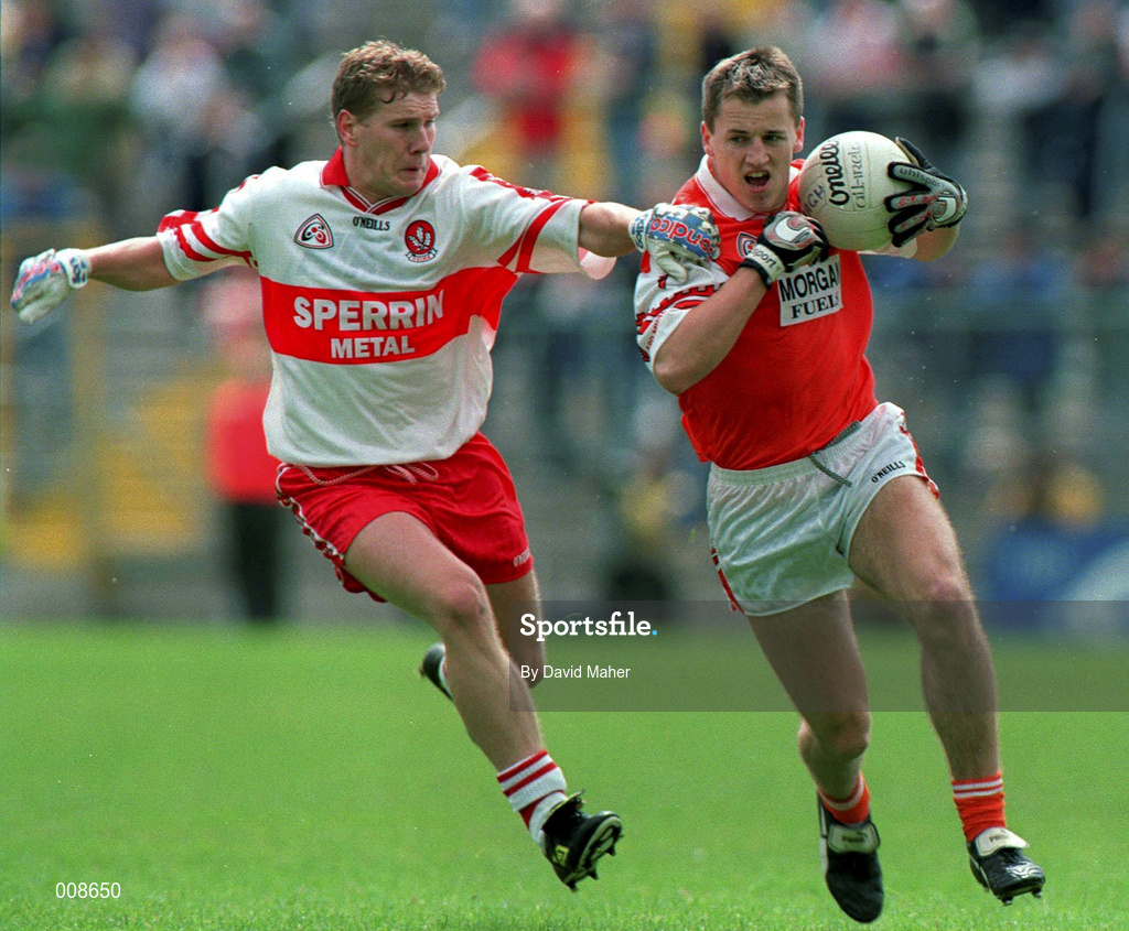 28 June 1998; Patrick McKeever of Armagh is tackled by Paul Diamond of Derry during the Bank of Ireland Ulster Senior Football Championship Semi-Final match between Armagh and Derry at St Tiernach's Park in Clones, Monaghan. Photo by David Maher/Sportsfile