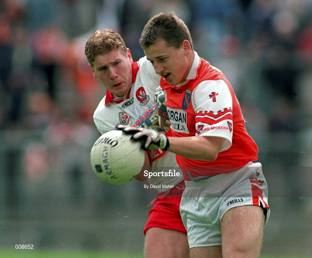 28 June 1998; Patrick McKeever of Armagh is tackled by Paul Diamond of Derry during the Bank of Ireland Ulster Senior Football Championship Semi-Final match between Armagh and Derry at St Tiernach's Park in Clones, Monaghan. Photo by David Maher/Sportsfile