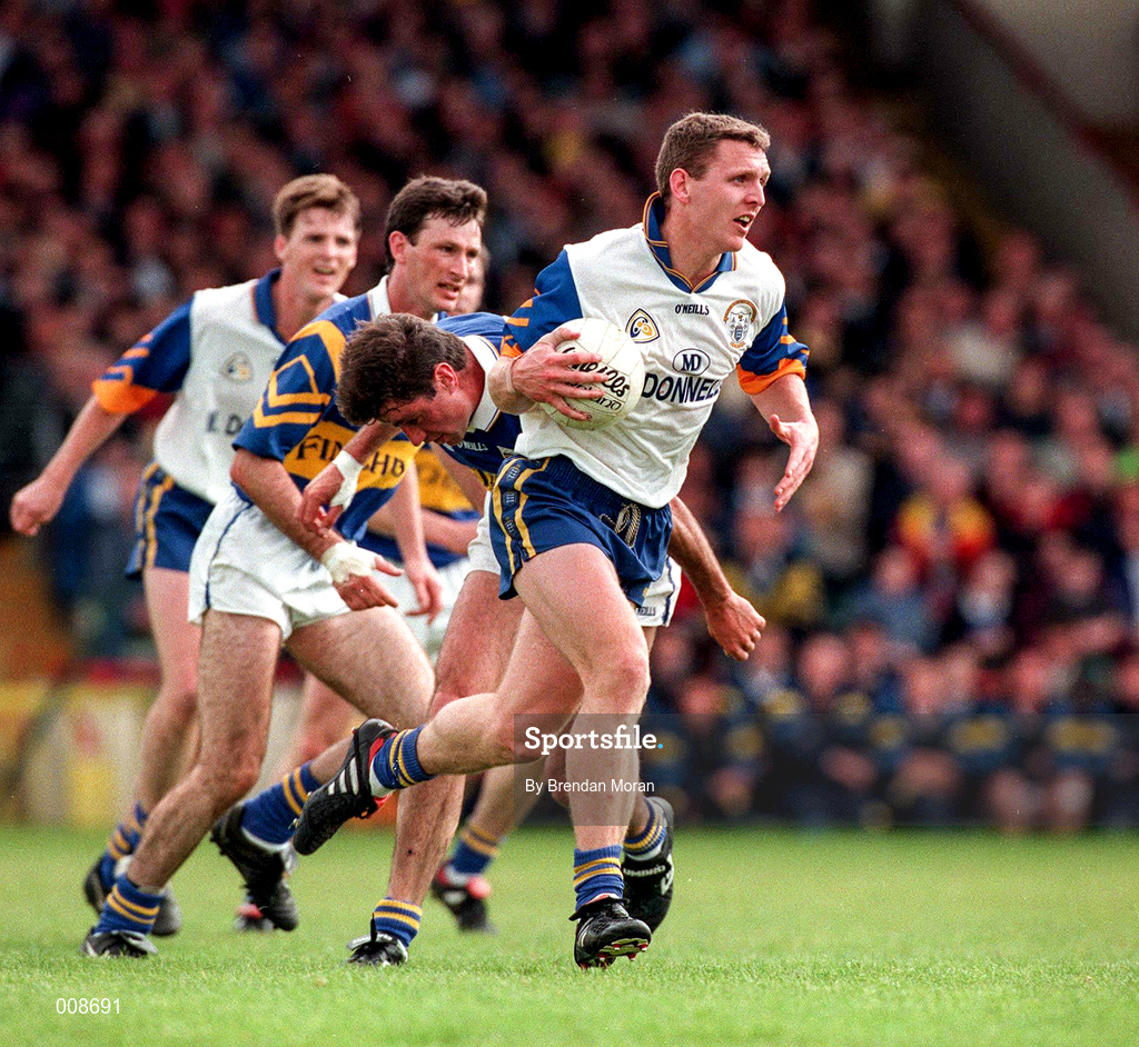 28 June 1998; Peter Cosgrove of Clare in action against Derry Foley of Tipperary during the Bank of Ireland Munster Senior Football Championship Semi-Final match between Tipperary and Clare at the Gaelic Grounds in Limerick. Photo by Brendan Moran/Sportsfile