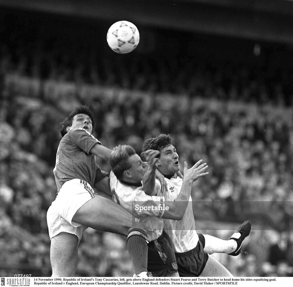 14 November 1990; Republic of Ireland's Tony Cascarino, left, gets above England defenders Stuart Pearce and Terry Butcher to head home his sides equalising goal. Republic of Ireland v England, European Championship Qualifier, Lansdowne Road, Dublin. Picture credit; David Maher / SPORTSFILE
