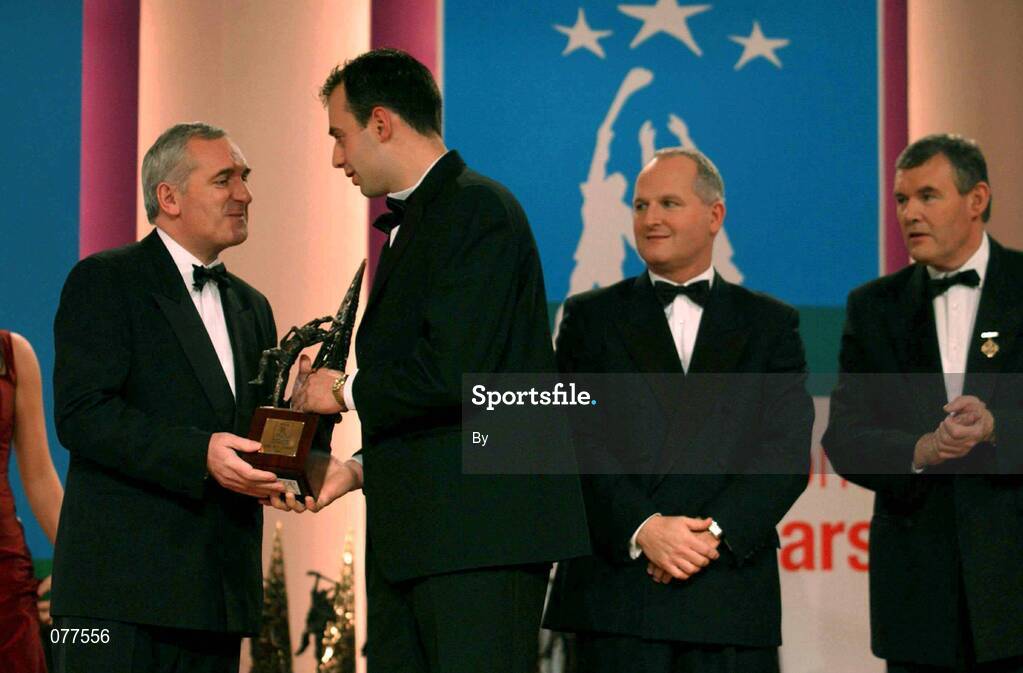 30 November 2001; Darragh Ryan, Wexford, receives his award from An Taoiseach Bertie Ahern TD, Paul Donovan, Chief Executive, Eircell Vodafone and Sean McCague, President, Cumann Luthchleas Gael, at the Eircell Vodafone AllStar Awards at the CityWest Hotel, Dublin. Hurling. Picture credit; Ray McManus / SPORTSFILE *EDI*