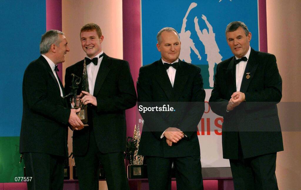 30 November 2001; Eamonn Corcoran, Tipperary, receives his award from An Taoiseach Bertie Ahern TD, Paul Donovan, Chief Executive, Eircell Vodafone and Sean McCague, President, Cumann Luthchleas Gael, at the Eircell Vodafone AllStar Awards at the CityWest Hotel, Dublin. Hurling. Picture credit; Ray McManus / SPORTSFILE *EDI*