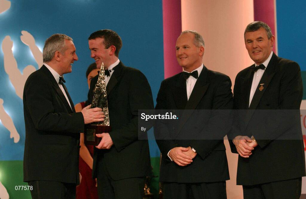 30 November 2001; Evan Kelly, Meath receives his award from An Taoiseach Bertie Ahern TD, Paul Donovan, Chief Executive, Eircell Vodafone and Sean McCague, President, Cumann Luthchleas Gael, at the Eircell Vodafone AllStar Awards at the CityWest Hotel, Dublin. Football. Picture credit; Ray McManus / SPORTSFILE *EDI*