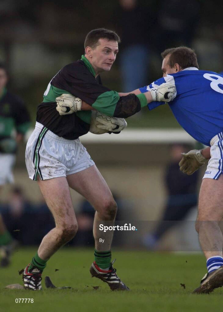 25 November 2001; Kevin Cahill, Nemo Rangers, holds off the challenge of Brian Burke, Fethard. Nemo Rangers v Fethard, Munster Club Football Championship Final, Pairc Mhic Gearailt, Fermoy, Co. Cork. Picture credit; Brendan Moran / SPORTSFILE *EDI*