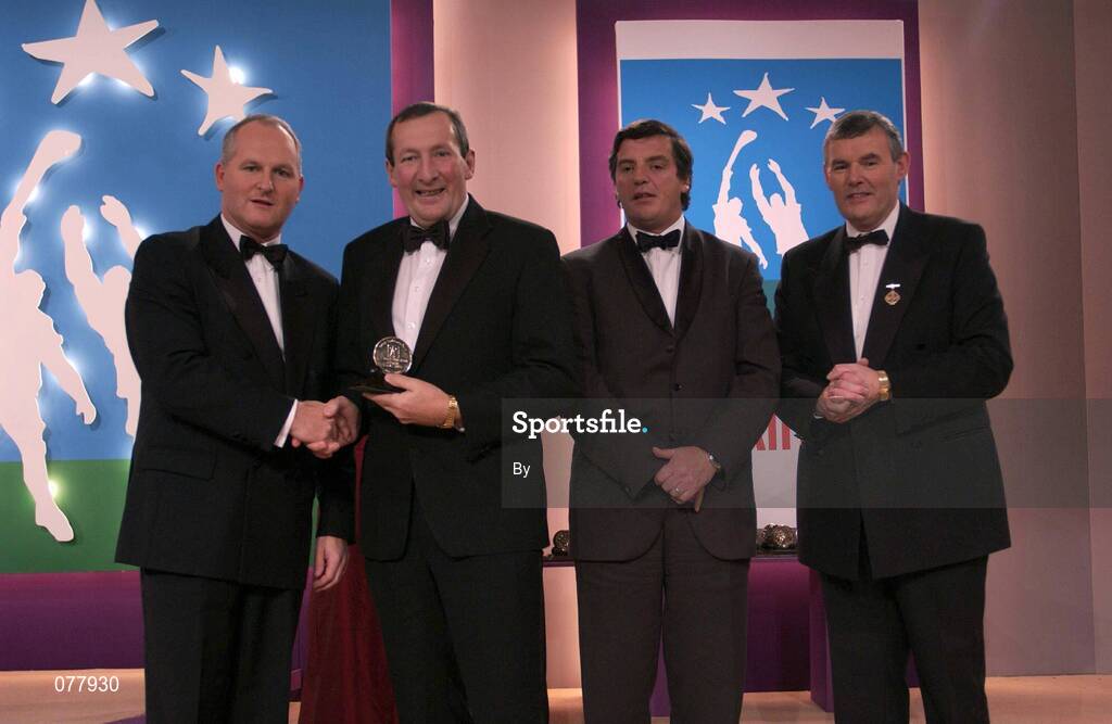 31 November 2001; Tim Kennelly, Kerry, who was presented with a Supreme Allstar Football Award, by Paul Donovan, left, Chief Executive, Eircell Vodafone at the Eircell Vodafone Allstar Awards at the Citywest Hotel, Dublin. Also in picture are Michael Roche, Managing Editor, Independent Newspapers, and Sean McCague, President of the GAA. Picture credit; Brendan Moran / SPORTSFILE *EDI*