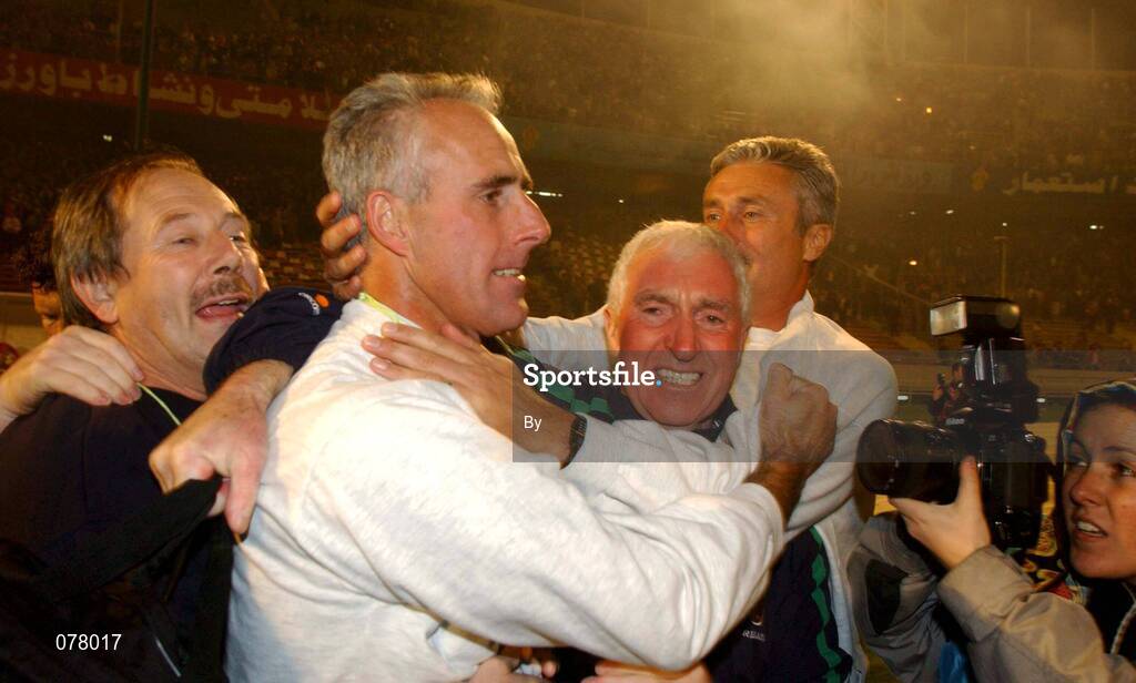 14 November 2001; Republic of Ireland manager Mick McCarthy, 2nd from left, celebrates qualification to the World Cup Finals with backroom staff Joe Walsh, Mick Byrne and Assistant manager Ian Evans. Iran v Republic of Ireland, World Cup Play off 2nd leg, Azadi Stadium, Tehran, Iran. Soccer. Picture credit; David Maher / SPORTSFILE *EDI*
