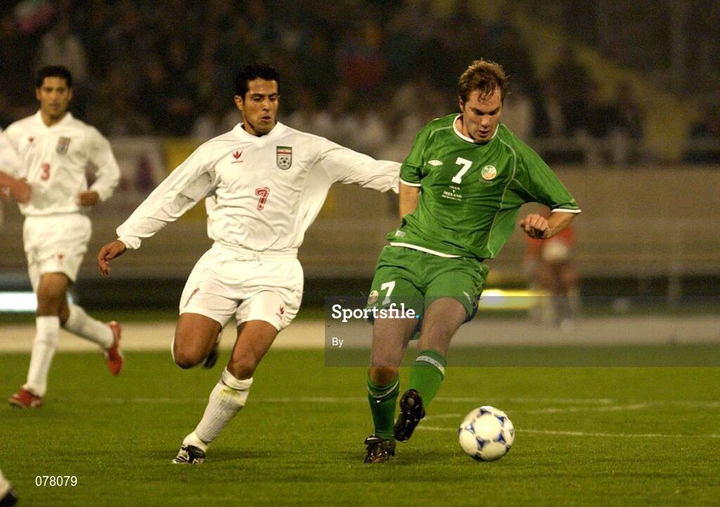 14 November 2001; Jason McAteer, Republic of Ireland, in action against Hamed Kavianpour, Iran. Iran v Republic of Ireland, World Cup Play off 2nd leg, Azadi Stadium, Tehran, Iran. Soccer. Picture credit; Brendan Moran / SPORTSFILE *EDI*