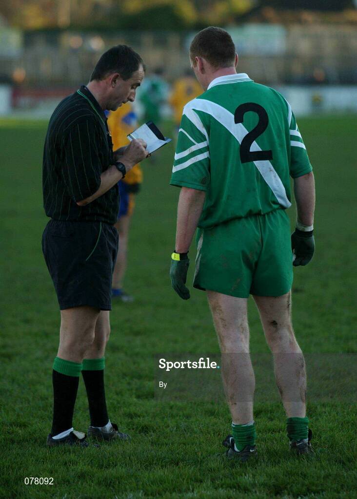 9 December 2001; Rereree  SŽamus McCormack books Nigel Campbell, Sarsfields, before sending him off. . Na Fianna v Sarsfields, AIB Leinster Club championship Semi-Final, Re-play of the Replay, St. Cloneth's Park, Newbridge, Co. Kildare. Football. Picture credit; Ray McManus / SPORTSFILE *EDI*