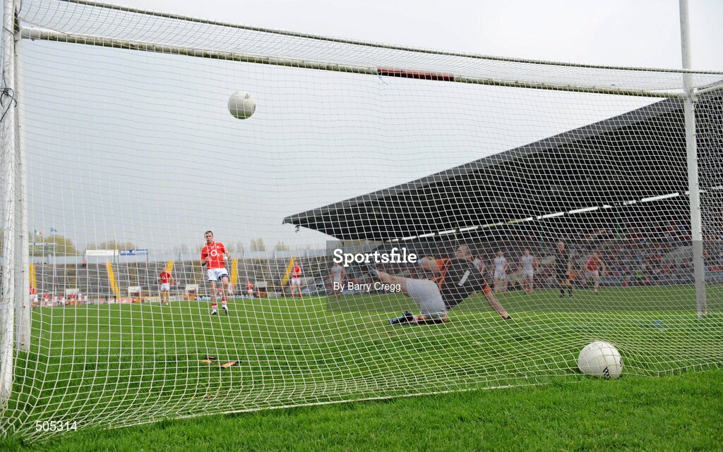 10 April 2011; Donncha O'Connor, Cork, scores a penalty against Armagh goalkeeper Paul Hearty to score his side's first goal. Allianz Football League, Division 1, Round 7, Cork v Armagh, Pairc Ui Chaoimh, Cork. Picture credit: Barry Cregg / SPORTSFILE