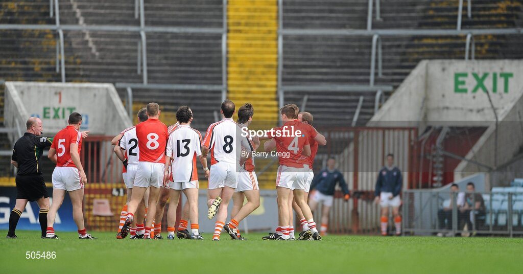10 April 2011; Referee Maurice Condon signals to Eoin Cadogan, 4, Cork, before issuing him with a red card. Allianz Football League, Division 1, Round 7, Cork v Armagh, Pairc Ui Chaoimh, Cork. Picture credit: Barry Cregg / SPORTSFILE